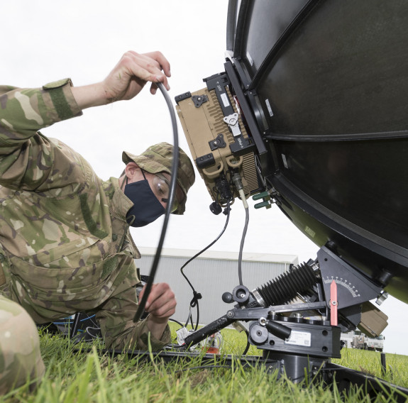 A New Zealand Army signallers setup a radio dish to establish communications