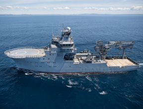 HMNZS Manawanui sails in the ocean on a nice day.