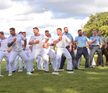 Personnel from the Royal New Zealand Navy, New Zealand Army and Royal New Zealand Air Force perform a haka at the Dave Gallaher Field.