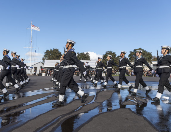 Officers and recruits march in formation on the parade ground during a graduation parade 