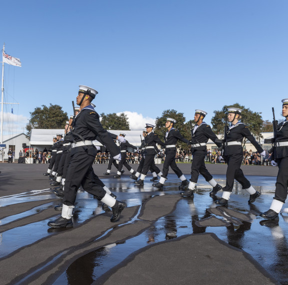 Officers and recruits march in formation on the parade ground during a graduation parade 