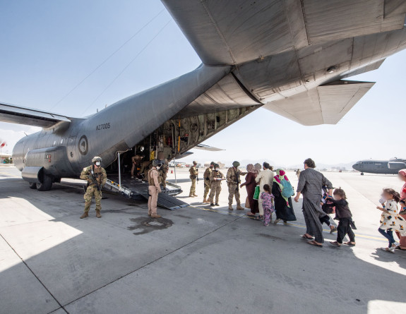 Evacuees board the Hercules aircraft at Hamid Karzai International Airport in Kabul