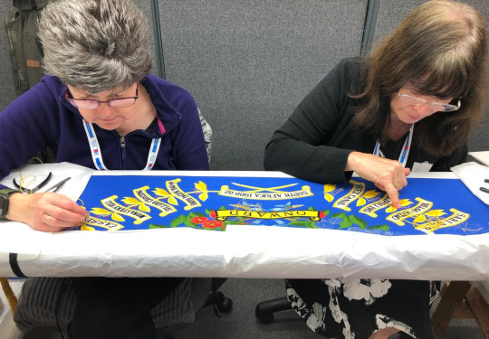 Susan Jones, left, and Wendy Hatton working on the 2/1 RNZIR Colours in Yorkshire before they were collected and brought back to New Zealand for last week’s ceremony