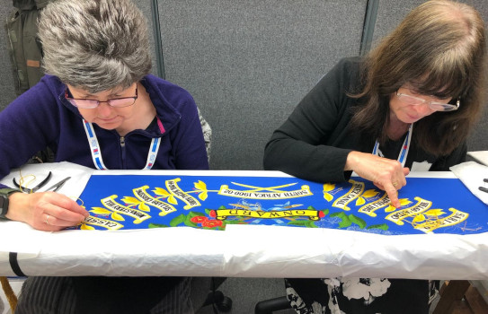 Susan Jones, left, and Wendy Hatton working on the 2/1 RNZIR Colours in Yorkshire before they were collected and brought back to New Zealand for last week’s ceremony