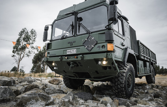 An HX60 MHOV drives over rocky terrain during testing and evaluation